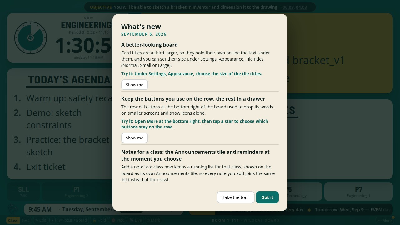 The What's new card over the board: the date, three changes each with a Try it line and a Show me button, and Take the tour and Got it at the foot.